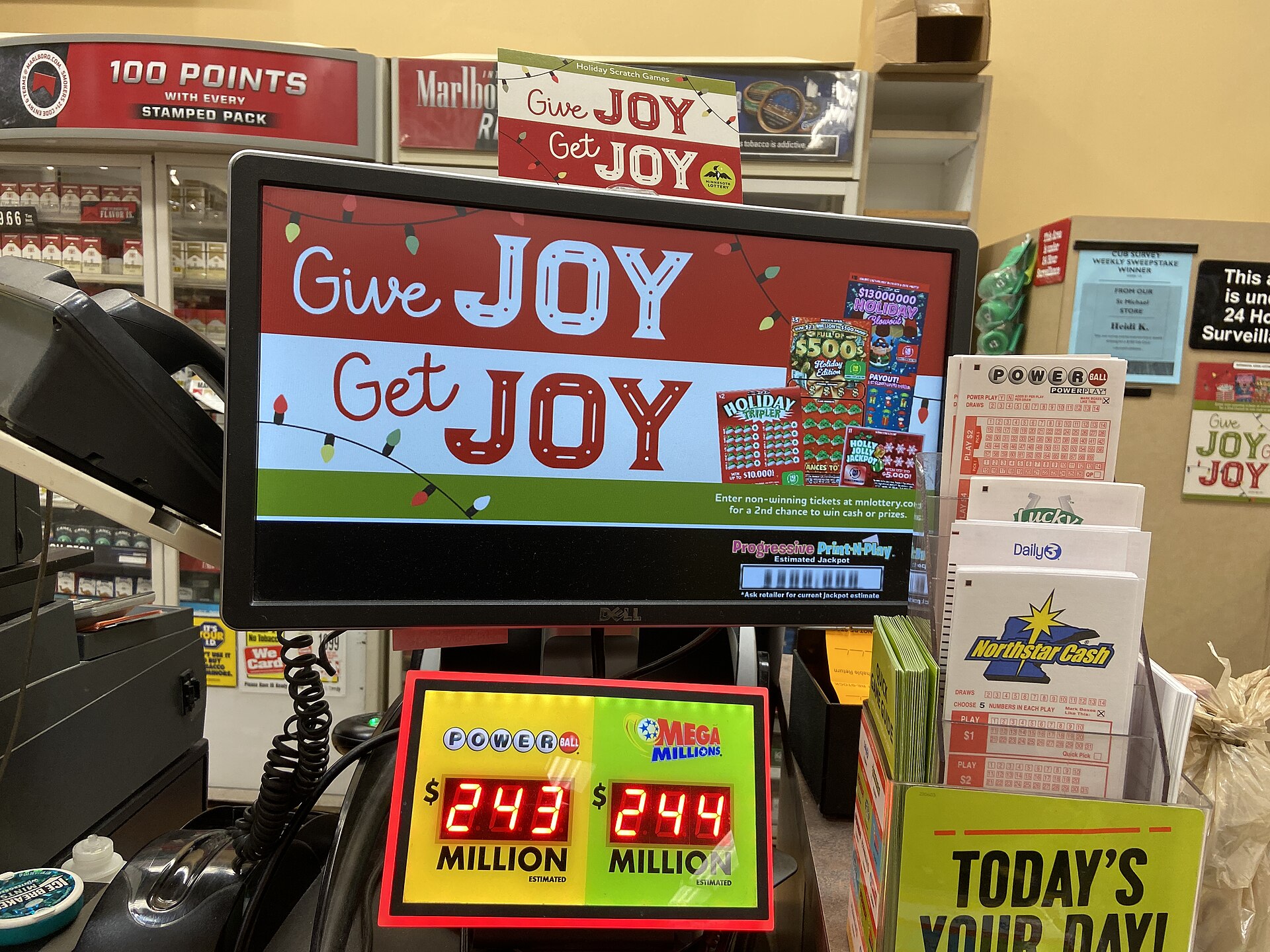 A convenience store counter shows lottery tickets and advertising for Powerball and Mega Millions, highlighting potential.